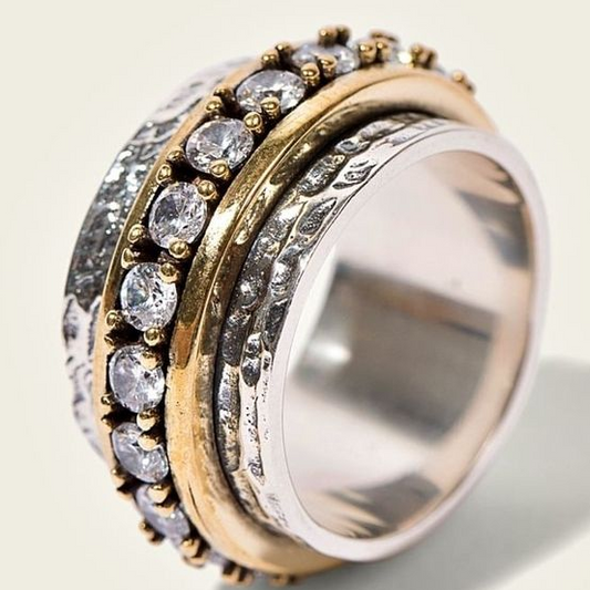Gold and silver ring with vintage zirconium stones